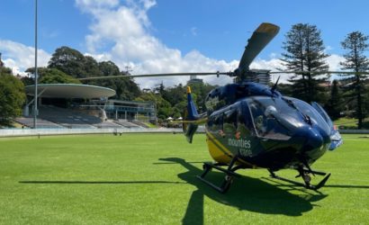 CareFlight H145 helicopter landed on a grassy field