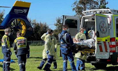 Patient being loaded into an ambulance