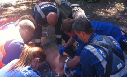 Doctors treating patient that feel from a tree