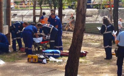 Doctors attenting to patient who feel from window